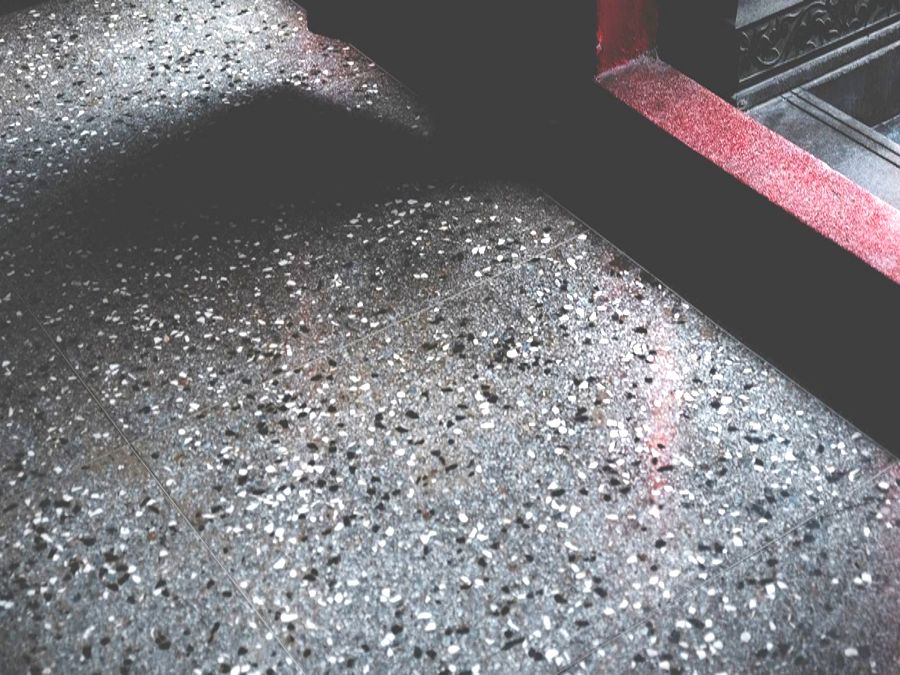 Close-up of a speckled, flake-style coated floor