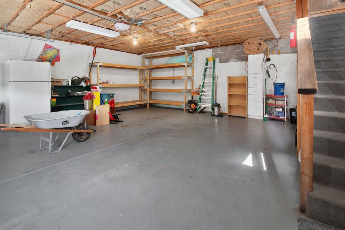 Spacious residential garage with a smooth gray coated floor