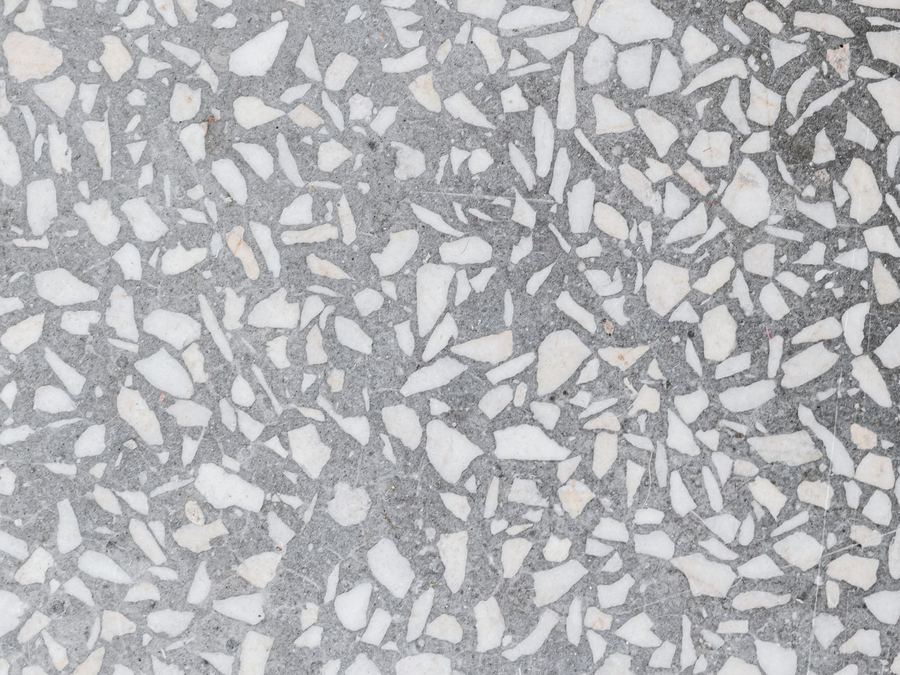 Close-up of a speckled quartz and terrazzo-style floor texture
