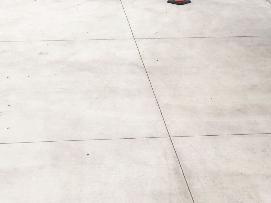 Bare concrete slab with a safety cone